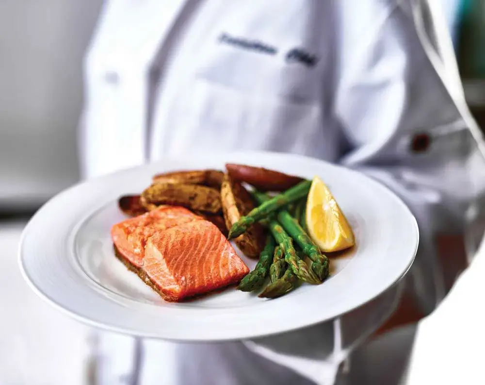 Mountain View Gardens Chef Created Meals, chef delivering a finished dish.