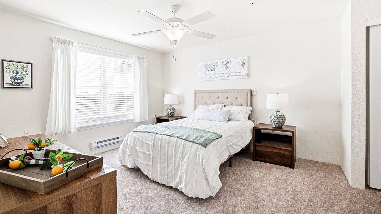 A furnished bedroom in a Mountain View Gardens apartment