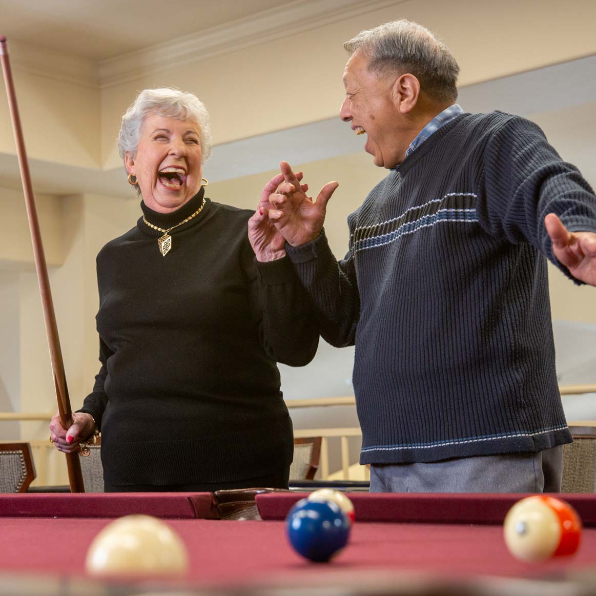 Residents playing billiards at Mountain View Gardens